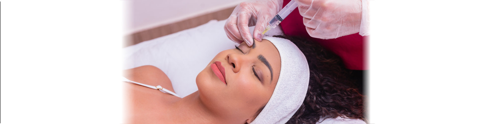 woman is getting a rejuvenating facial injections